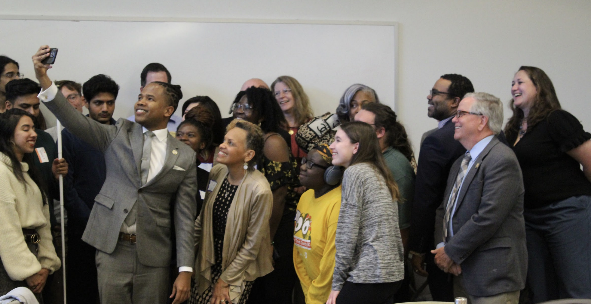 Delegate Acevero takes a selfie with UMBC community members and other state legislators and policy actors